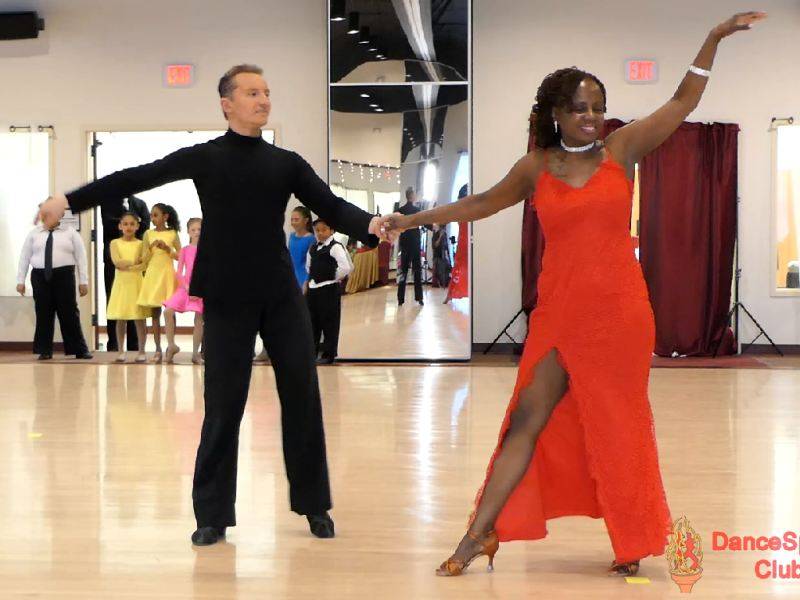 Denis dancing Rumba with student at Holiday Showcase