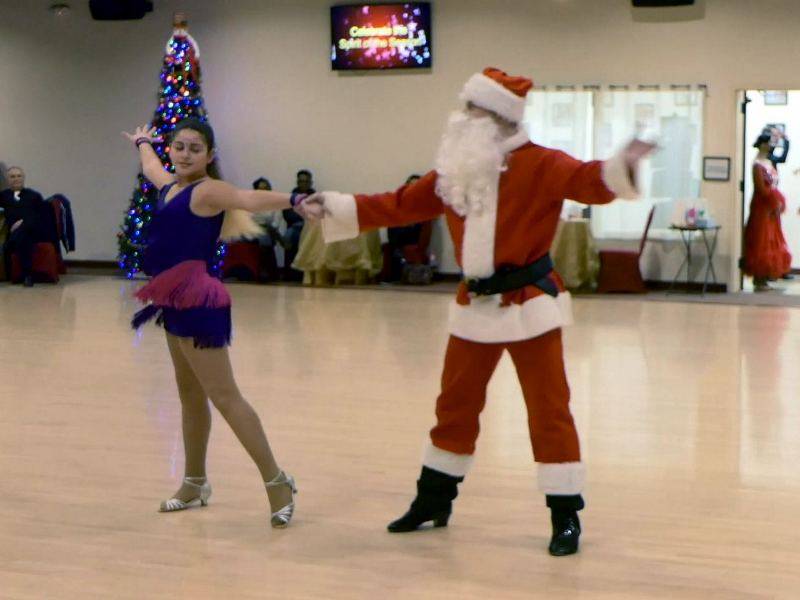 Denis dancing jive with student at Holiday Showcase